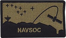 Navy Working Uniform "Type III" unit shoulder patch featuring the NAG emblem elements: Ursa Major and Polaris as a reference to celestial navigation and a stylized satellite orbiting Earth. Also shown are Laguna Peak and Mugu Rock. Naval Satellite Operations Center patch.jpg