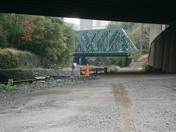 Before re-routing to Hoboken Terminal, Northern Branch trains passed under DL&W bridge near the western portals of the Long Dock Tunnel and later, Ber