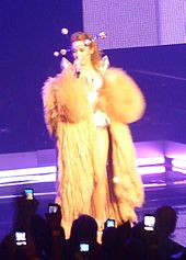 Minogue performing the song during her For You, For Me Tour, 2009. P1020851 2 (4011272004) (cropped).jpg