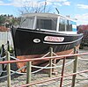 The ''Persephone'' tugboat, also from the series