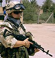 Polish soldiers with a Civilian Military Cooperation team provide security while others conduct a survey of a building currently under renovation as a possible site for a new medical facility June 9, 2008, in Ad Diwaniyah, Iraq