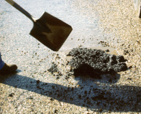 Throw-and-roll pothole repair procedure—material placement