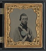 Private Peter S. Arthur of Company B, 11th Virginia Infantry Regiment, in uniform with secession badge and Virginia state seal breastplate LCCN2012646157.jpg