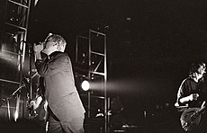 One of the first popular alternative rock bands, R.E.M. relied on college radio airplay, constant touring, and a grassroots fanbase to break into the musical mainstream. R.E.M., Belgium, 1985.jpg