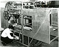 Overall view of the laboratory prototype machine developed for the Post Office for the automatic high-speed sorting of letter mail. It can sort at the rate of 36,ooo letters per hour into as many categories as may be needed. It consists essentially of a large number of pockets on an endless conveyor and electromechanical equipment that controls the dropping of a letter from a pocket into a specific fixed receptacle. As can be seen in the photographs, fourteen pockets are grouped together into a single unit for convenience of handling on the conveyor. In 1957 Jacob Rabinowâ€™s company, Rabinow Engineering, designed a mechanical coding and sorting system for the U.S. Post Office. Based on similar work Rabinow had done previously for the Census Bureau, the system for the Post Office consisted of a conveyor belt cart designed to carry 12 envelopes in separate compartments. Each compartment in the cart was accompanied by an escort memory. The escort memory consisted of a shaft carrying a series of nylon code wheels. Each of the 134 wheels could move laterally into one of two positions. With this combination, more than 8000 (in decimal notation) binary numbers could be set. Twelve keyboard operators would read envelope addresses and set the positions of the code wheels. The wheels were supported on a track also composed of binary elements. When the encoded compartment hit the same encoded position on the track, the shaft dropped, triggering a door release in the compartment holding the envelope. The envelope then fell into the appropriate pocket. About 600 of the letter sorting machines were built and used by the Post Office. In later operations optical character recognition technology replaced the keyboard operators, and the mechanical escort memory was replaced by computer memory. Reference: Inventing for Fun and Profit. Jacob Rabinow. San Francisco Press, San Francisco, CA. (1990). pp. 100-138.