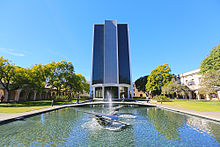 The Millikan Library, the tallest building on campus. In January 2021, the Caltech Board of Trustees authorized removal of Millikan's name from campus buildings. Robert A. Millikan Memorial Library at Caltech.jpg