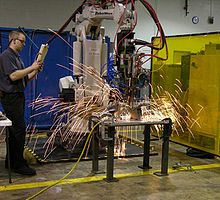 Sparks from spot welding robot Robotworx-spot-welding-robot.jpg