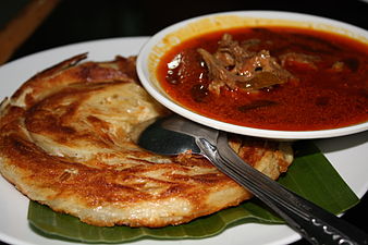 Roti cane with mutton curry (top)