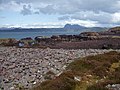 Rubh a Choin Rocky shoreline near the end of the peninsula between Garvie and Achnahaird bays. Suilven in the distance across Enard Bay.