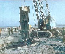 Ukrainian workers use equipment provided by the U.S. Defense Threat Reduction Agency to dismantle a Soviet-era missile silo. After the end of the Cold War, Ukraine and the other non-Russian, post-Soviet republics relinquished Soviet nuclear stockpiles to Russia. SS-24 silo destruction.jpg
