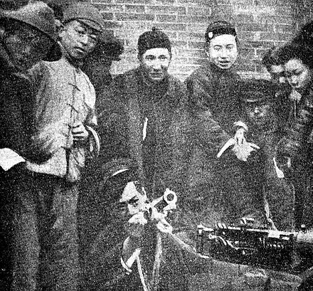 Shanghai workers posing with weapons in 1927. After successfully ousting the Zhili Clique and handing the city over to the Kuomintang, the Communist-allied workers were massacred.