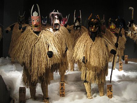 Several namahage wearing outfits incorporating mino.