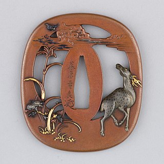 A tsuba carved with a sika deer made by Fujiwara Toshiyoshi. 1800s. The Metropolitan Museum of Art.
