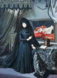 Anna Maria Luisa in The Electress Palatine in mourning dress by Jan Frans van Douven, 1717. She points to the portrait of Johann Wilhelm's remains, adorned with the Palatine regalia, in the milieu. The Dowager Electress Palatine in mourning.jpg