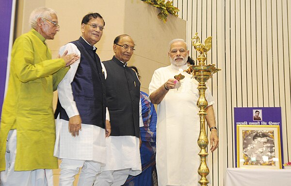 The Prime Minister, Shri Narendra Modi lighting the lamp at the Golden Jubilee celebrations of the works of Rashtrakavi Ramdhari Singh Dinkar, in New 