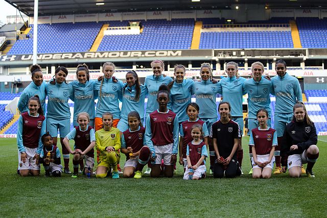 West Ham team with their player escorts in April 2017 prior to a match against Tottenham Hotspur at White Hart Lane.