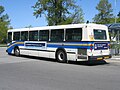An older regular-length high-floor diesel bus. (Running route #84)