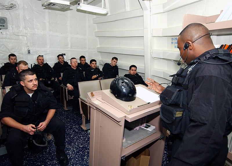 File:US Navy 040224-N-4374S-003 Members of the Vessel, Board, Search, and Seizure (VBSS) team assigned to the guided missile destroyer USS Roosevelt (DDG 80) conduct a safety brief prior to departing on a Maritime Interception Opera.jpg