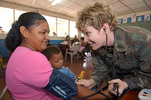 US Navy 050310-N-1159B-114 Lt. Cmdr. Lisa Kromanaker, a nurse assigned to Operational Health Support Unit Great Lakes, Ill., measures the blood pressure of a Nicaraguan woman during a Medical Readiness Training Exercise.