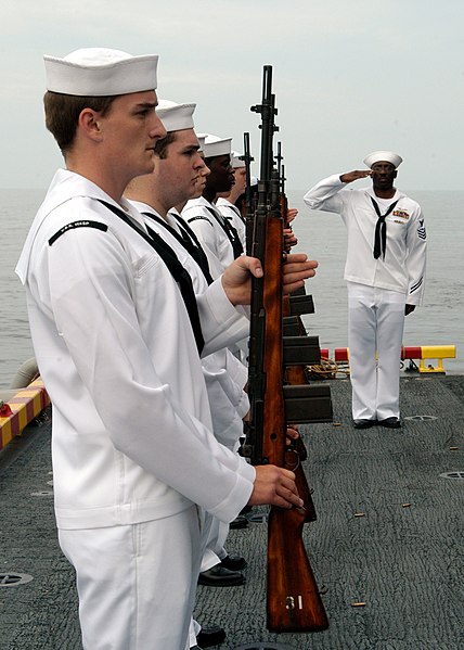 File:US Navy 050730-N-3666S-094 The honor guard aboard the amphibious assault ship USS Wasp (LHD 1) pays respect to a past shipmate during one of three burial at sea ceremonies held aboard the ship.jpg