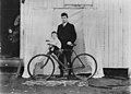 Unidentified father and son, posing with a bicycle for a travelling photographer, ca. 1910 (3305268007).jpg