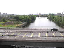 The Kelvin flowing under the Clydeside Expressway and into the River Clyde