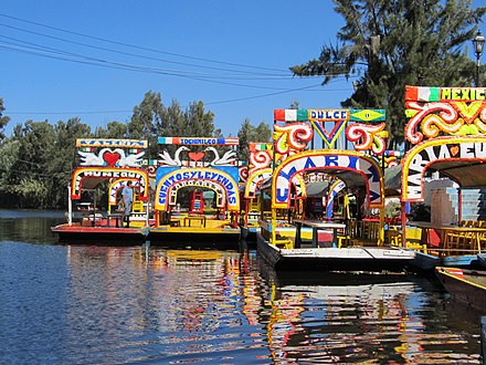 Trajineras in the canals of Xochimilco. Xochimilco and the historic center of Mexico City were declared a World Heritage Site in 1987.