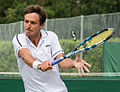 Édouard Roger-Vasselin competing in the second round of the 2015 Wimbledon Qualifying Tournament at the Bank of England Sports Grounds in Roehampton, England. The winners of three rounds of competition qualify for the main draw of Wimbledon the following week.