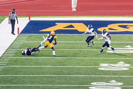 The East Texas Baptist football team in action against the Texas A&M–Commerce Lions in 2014