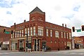 2 story building corner of Lee and S Main St