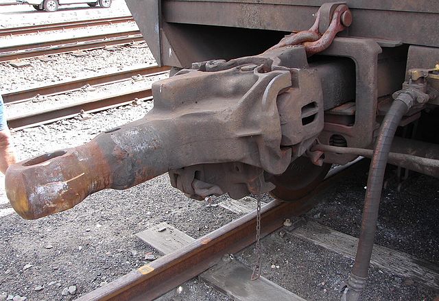 AAR Type F Interlock couplers, rigid version at right and rotary version at left. The one on the left lost its pin and was pulled out of its coupler p