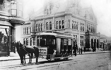 A horse-drawn streetcar in front of the Los Angeles post office on Main Street, circa 1892.jpg