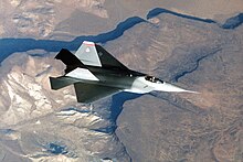 The YF-22 design (Configuration 1132) with diamond-like delta wing planform. An air-to-air overhead view of the YF-22 advanced tactical fighter aircraft during a test flight DF-ST-92-09938.jpg