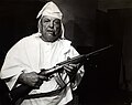 Armed KKK Klansman William Donta holds a gun in southeastern Ohio, 1987.