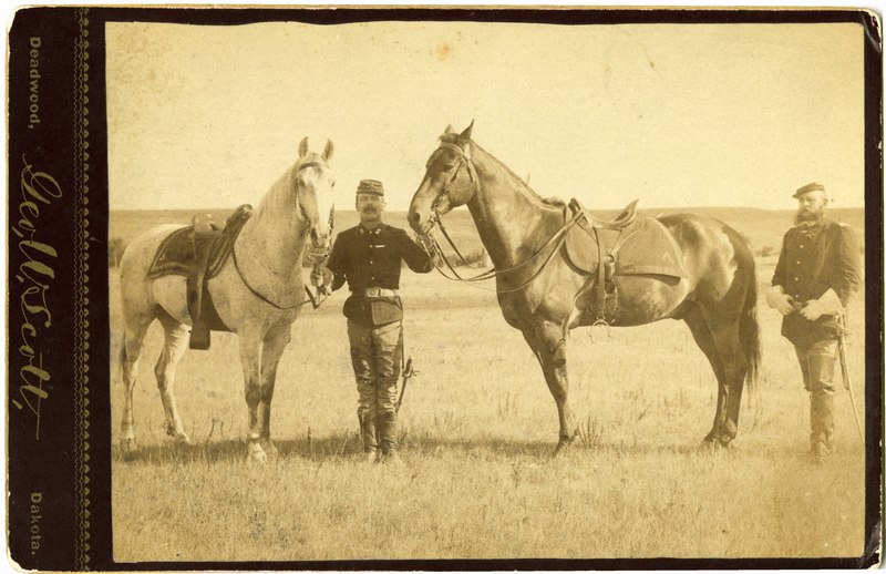 File:Blacksmith Karn Holding Reigns of Comanche and an Unknown Horse while Captain Charles Illsley Looks on (eddaf10953b34d279028e313283b43a3).tif