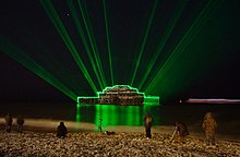 The West Pier illuminated with lasers (2010) curated by Josef O'Connor Brighton's West Pier illuminated with lasers (2010).jpg