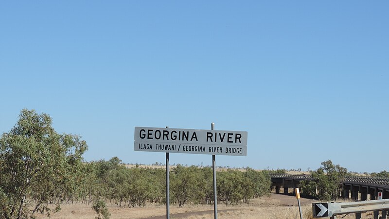 File:Crossing the bridge over the waterless Georgina River on the Barkly High heading west out of Camooweal, 2019.jpg