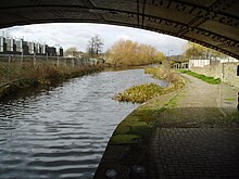 A short section above the fourth lock remains in water, although the top gate of the lock has been replaced by a concrete wall