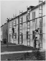 Dortmund, Germany. Painter put finishing touches on Dortmund Housing Project, built to help bring labor stability to... - NARA - 541697.tif