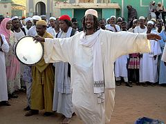 A Sufi dervish drums up the Friday afternoon crowd in Omdurman, Sudan