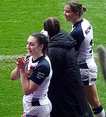 England women's rugby league players taking a lap of honour at 2021 WRLWC England women's rugby league players.jpg