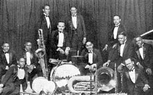 The Fletcher Henderson Orchestra in 1925. Armstrong is the third person from the left. FletcherHendersonOrchestra1925.jpg