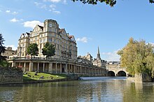 Empire Hotel with Pulteney Bridge beyond Former Empire Hotel and Pulteney Bridge, Bath.jpg