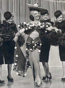 Carmen Miranda as Dorita in The Gang's All Here. In 1946, she was the highest-paid actress in the United States.