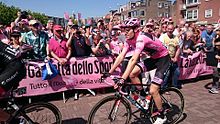 Dumoulin wearing the maglia rosa of general classification leader, at the 2016 Giro d'Italia Giro 2016 inscription stage 2 39.jpg