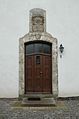 Portal of the main building with a coats of arms above