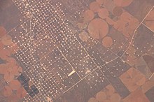 A New Mexico oil field, left, with crop circles on right, taken from the ISS in 2006 ISS013-E-28440.jpg