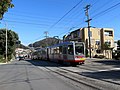 Thumbnail for File:Inbound train passing Ulloa and 14th Avenue, February 2019.JPG