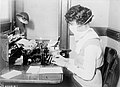 Masked typist during influenza pandemic, 1918