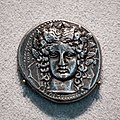 Katane - 410-404 BC - silver tetradrachm - head of Apollon - charioteer driving quadriga and Nike - Berlin MK AM 18206564